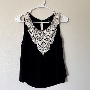 Black shirt with details in front. Size S from forever 21